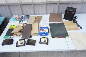 lot 145 image: Garage...Holmes Heater, Sandpaper and Lots of It