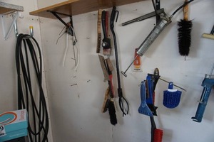 lot 192 image: GarageAutomobile...Wall of Grease Guns, Cleaning Brushes, Scrapers Etc.