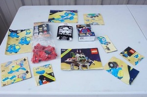 lot 252 image: VintageCollectibleToys...Collection of Vintage Lego Instruction ManualsBooklets, Star Wars Watch, Superman Key Chain
