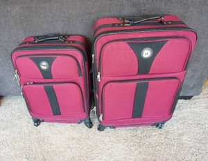 lot 341 image: Luggage...Leisure International Two Piece Matching Burgundy Luggage on Wheels with Pull Handles