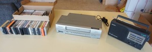 lot 379 image: ElectronicsMusicCassettes...Sony ICF-34 Black AMFMTVWeather TV Sound 4 Band Radio Tested Working, Emerson  VHS Player, Music Cassettes Etc.