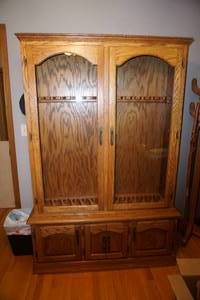 lot 410 image: FurnitureDen...Solid Oak Two-Piece Gun Cabinet