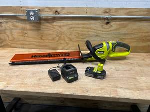lot 11 image: RYOBI ONE 18V 22 in. Cordless Battery Hedge Trimmer with 1.5 Ah Battery and Charger