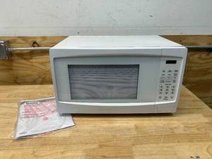 lot 20 image: DANBY DBMW1120BWW 1.1 Cu.Ft. Countertop Microwave In White - 1000 Watts, Family Size Microwave With Push Button Door
