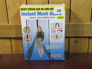 lot 28 image: Instant Mesh Guard - Hands - Free Screen Door