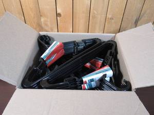 lot 21 image: Box Full of Plastic Hangers