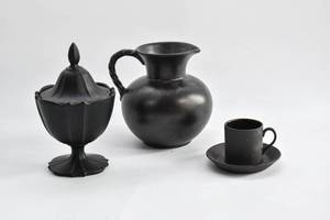 lot 158 image: Four Black Ceramic Serving Items