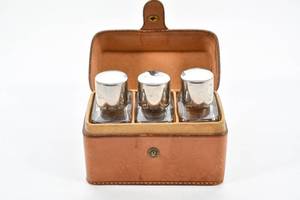 lot 166 image: Three Perfume Bottles in a Leather Case
