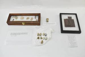 lot 87 image: Seventeen Civil War Artifacts Including a Domino, a Lock, and Bullets