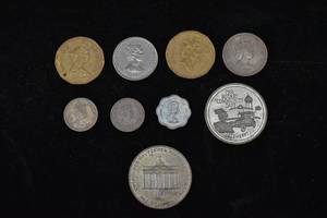 lot 268 image: Nine Vintage Coins from Canada, Germany, and the Caribbean