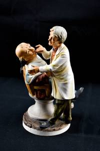 lot 295 image: Dentist and Patient Statuette by Norleans