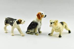 lot 150 image: Group of Three Ceramic Dog Statuettes