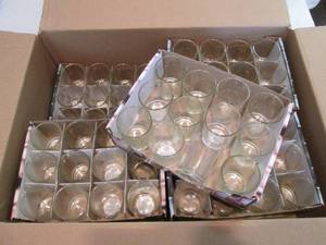lot 129 image: Box of 96 clear glass votive jars...