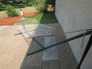 lot 97 image: Large hammock on sturdy metal base...
