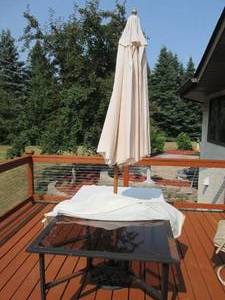 lot 94 image: Glass top patio table with cover an...