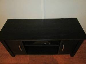 lot 15 image: Table with cupboards below.