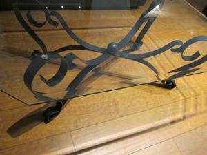 lot 16 image: Beveled edge glass top coffee table.