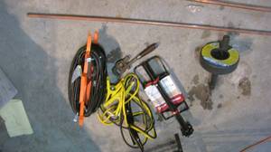 lot 275 image: Jumper cables, extension cord, bike...