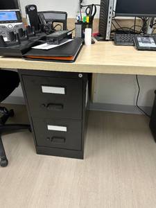 lot 10 image: Two door metal filing cabinet 15x25x29