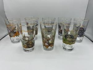 lot 28 image: Vintage Budweiser Drinking Glasses with OutdoorHunting Theme Lot of 8