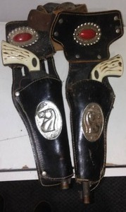 Vintage Toy pistols and leather holster.