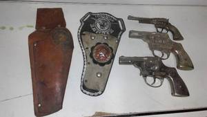 Vintage holsters and pistols.