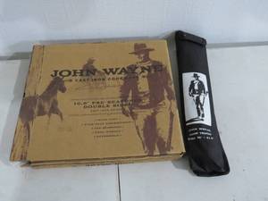 lot 22 image: New - John Wayne Cast-Iron Double-Sided Griddle and John Wayne Camp Tripod