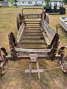 lot 7 image: John Deere Model D Horse-Drawn 4-Wheel Manure Spreader with Apron, Beaters, and Chains, Ready for Restoration, Serial No. 5000