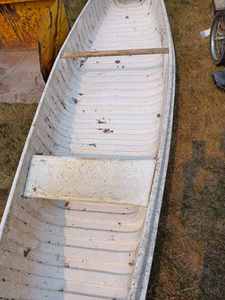 lot 10 image: 1969 Sea Ray 17-foot Plastic Canoe, Has some damage to the plastic on top at one end, no paddles, Comes with Registration Card and 2023 License Tab