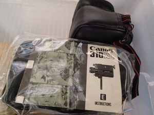 lot 53 image: Covered Tote full of Vintage Cameras, Movie Cameras, and Lights and a Sony DVD Player - Missing Remote