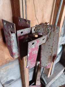 lot 71 image: Set of Four Steel Brackets to Bolt to the Running Gear to Secure Hayracks or Wagon Boxes to the Running Gear