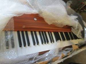 keyboardpiano with legs open box ...