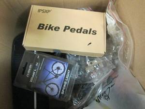 box of bike tools, pedals and light...