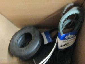 box of lawnmower belts , tire and m...