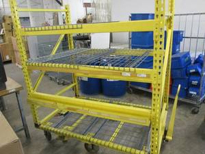 yellow cart on wheels and a hitch w...