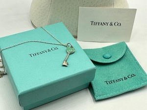 lot 31 image: Tiffany & Co Sterling Silver and Blue Enamel Heart Key Necklace