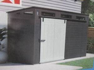 lot 337 image: Suncast Modernist 10 ft. W x 7 ft. D Plastic Shed with Barn Door (78.29 sq. ft.) - OPEN BOX