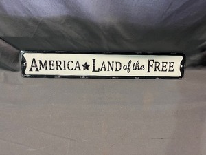 lot 25 image: America Land of the Free Metal Sign