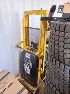 lot 2 image: Powered-LiftManual-Push Fork-Over Stacker by Big Joe