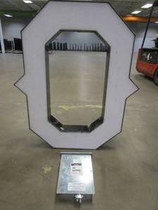 lot 103 image: Lighted Letter O Outdoor Signage With Transformer. Approximate Dimensions 35 x 5.25 x 42.5 Tall - USED FOR RETAIL BRAND MN HOME OUTLET.
