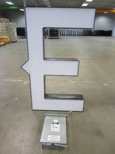 lot 105 image: Lighted Letter E Outdoor Signage With Transformer. Approximate Dimensions 28 x 5.25 x 42.5 Tall - USED FOR RETAIL BRAND MN HOME OUTLET.