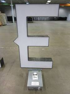lot 110 image: Lighted Letter E Outdoor Signage With Transformer. Approximate Dimensions 28 x 5.25 x 42.5 Tall - USED FOR RETAIL BRAND MN HOME OUTLET.