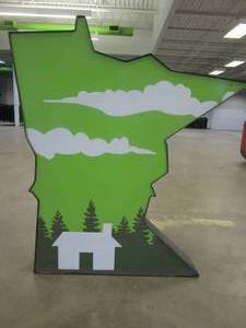 lot 136 image: Lighted Iconic MN HOME OUTLET BRAND SIGN Outdoor Signage, Transformer Not Included. Approximate Dimensions 39 x 5.25 x 43.5 Tall - USED FOR RETAIL BRAND MN HOME OUTLET.
