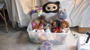 A giant tote full of dolls and more