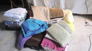 A giant suitcase packed full of towels