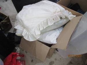 Box full of pillows and blankets