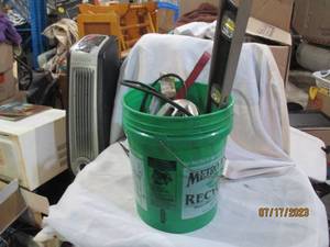 Bucket of tools and sports gear
