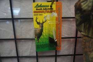 lot 79 image: Lohmans Model 1141 Mouth Adjustable Deer GruntBleat Call With Bowtech Baseball Cap