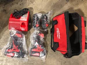 Milwaukee M18 18V Lithium-Ion Brushless Cordless Compact DrillImpact Combo Kit (2-Tool) W (2) 2.0Ah Batteries, Charger & Bag   Customer Returns See Pictures