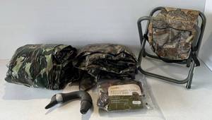 lot 81 image: Group Of Misc. Hunting Items Including Camouflage Tarps, Cabelas Standard Camo Decoy Mesh Bag ( NIB ) , Camo Folding Chair And More
